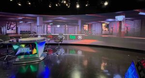Fox Sports Ultra-Wide Screen with Presenters at Desk